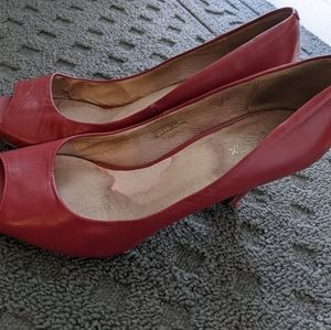 Well worn red pumps size 10